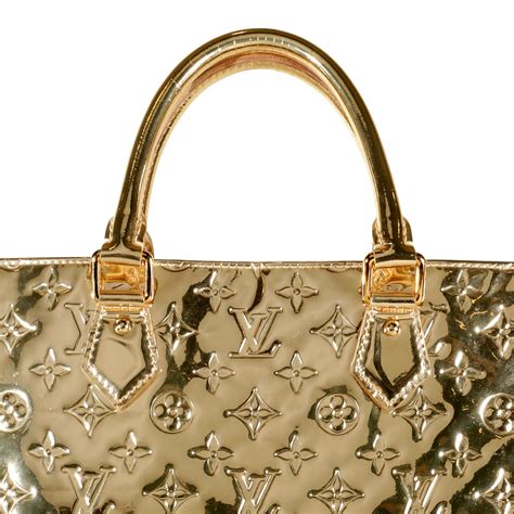 louis vuitton gold miroir sac plat|More.